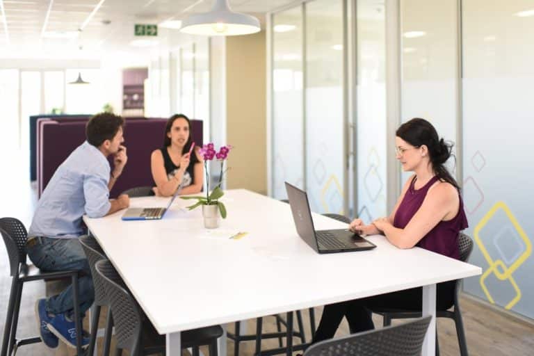 People working at meeting at a hot-desk in Cape Town